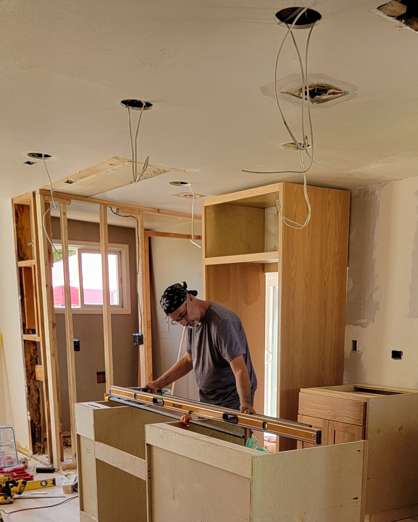 Phil leveling custom cabinetry on site